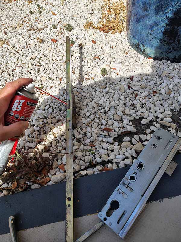 Lubricating the hook unit on a multi-point locking mechanism