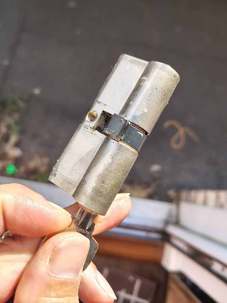 Removed euro cylinder lock showing cam